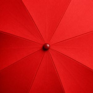 A stylized scene centered on an umbrella in atmospheric light.